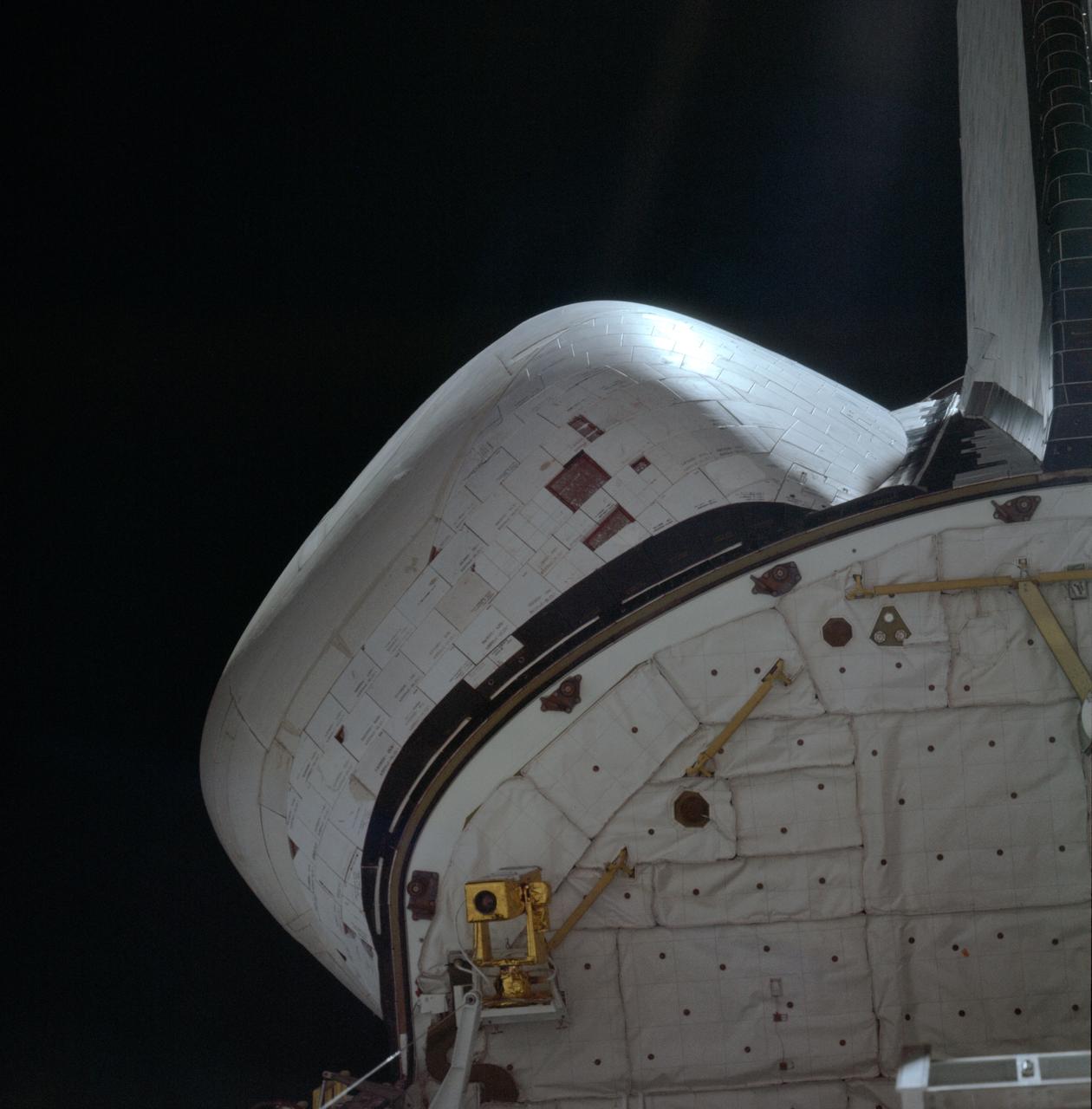 STS001-08-289 (12-14 April 1981) --- A 250mm Hasselblad view of the left OMS pod and missing tiles. Photo credit: NASA
