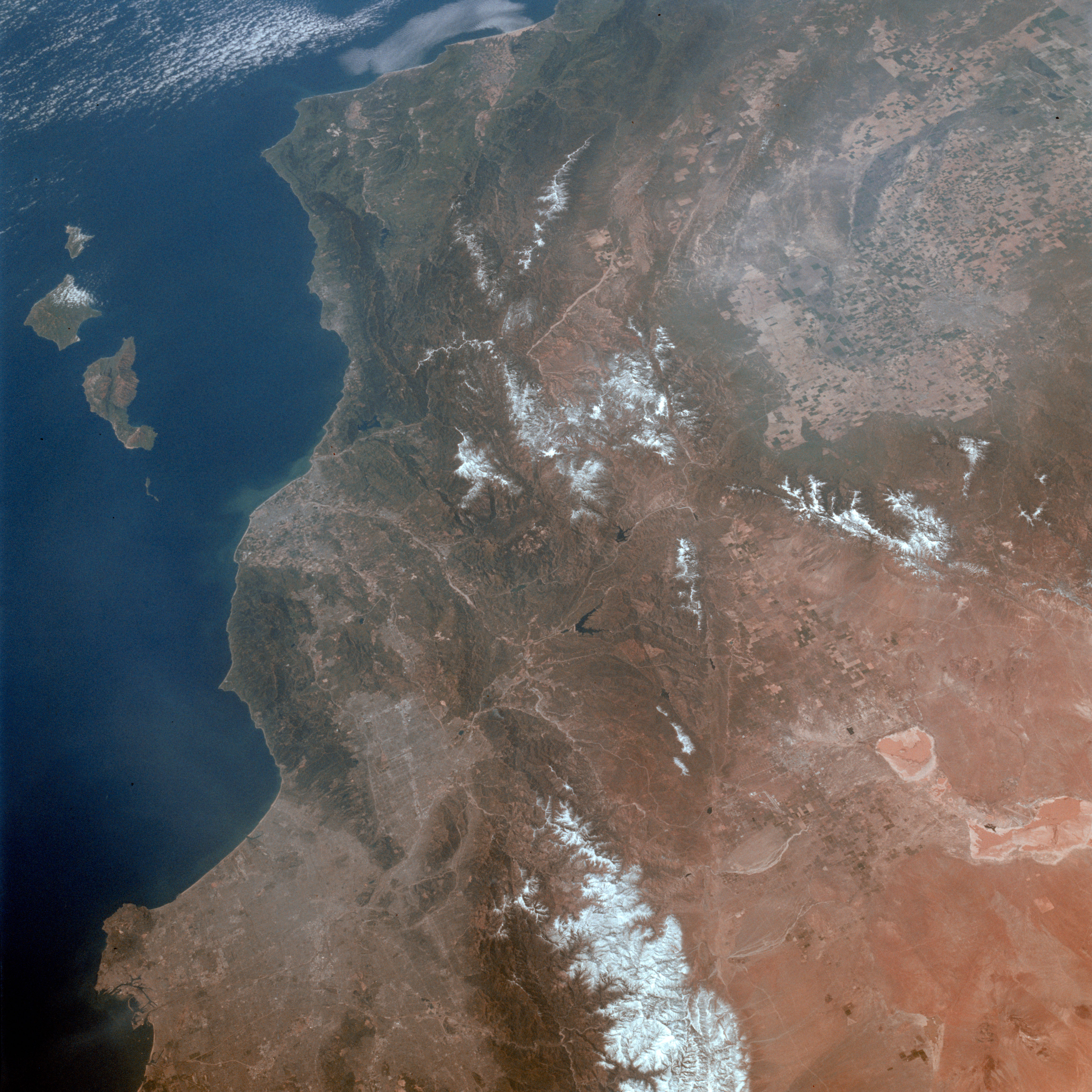 STS003-010-593 (30 March 1982) --- A general view of the greater Los Angeles region of California (34,0N, 118.5W) showing the coastline, Vandenberg AFB, the south end of the Central Valley and the dry lake beds at Edwards AFB.  A close look can pinpoint water on the lake beds at Edwards Air Force Base used previously for two shuttle landings.  Among other features that can be seen are Oxnard, Santa Barbara, Bakersfield, Vandenberg Air Force Base, and The Ranch. Photo credit: NASA