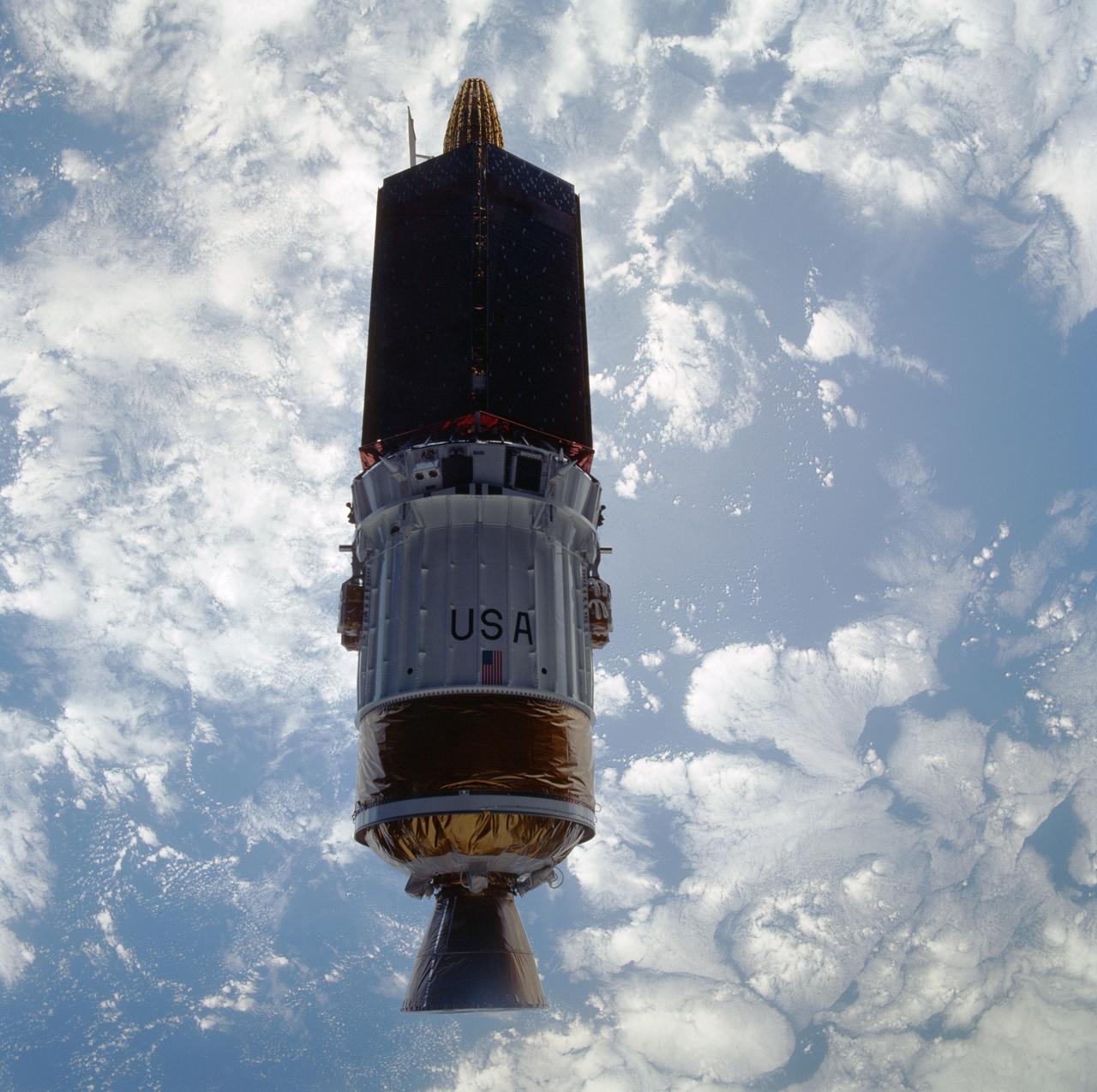 STS043-601-033 (2 Aug 1991) --- The Tracking and Data Relay Satellite (TDRS-E), is seen almost as a silhouette in this 70mm image.  The TDRS spacecraft was captured on film as it moved away from the earth-orbiting Atlantis a mere six hours after the shuttle was launched from Pad 39A at Kennedy Space Center, Florida.  TDRS, built by TRW, will be placed in a geosynchronous orbit and after on-orbit testing, which requires several weeks, will be designated TDRS-5.  The communications satellite will replace TDRS-3 at 174 degrees west longitude.  The backbone of NASA's space-to-ground communications, the Tracking and Data Relay Satellites have increased NASA's ability to send and receive data to spacecraft in low-earth orbit to more than  85 percent of the time.  Before TDRS, NASA relied solely on a system of ground stations that permitted communications only 15 percent of the time.  Increased coverage has allowed on-orbit repairs, live television broadcast from space and continuous dialogues between astronaut crews and ground control during critical periods such as space shuttle landings.  The five astronauts of the STS-43   are John E. Blaha, mission commander, Michael a. Baker, pilot, and mission specialists Shannon W. Lucid, G. David Low and James C. Adamson.