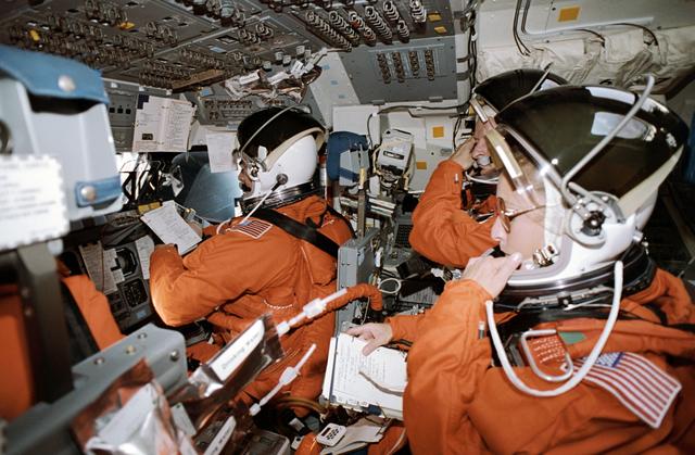 NASA image: STS-46 crew, wearing LESs, prepares for deorbit on OV-104's flight deck
