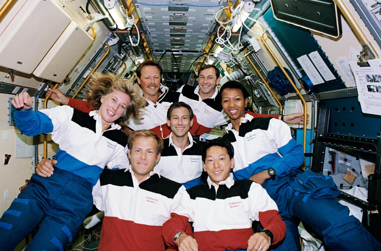 STS047-09-009 (12 - 20 Sept 1992) --- The seven crew members sharing eight days of research in support of Spacelab-J pose for the traditional inflight portrait in the Science Module.  Pictured, left to right, back row, are Robert L. Gibson, mission commander; and Curtis L. Brown, Jr., pilot; middle row, N. Jan Davis, Jerome (Jay) Apt and Mae C. Jemison, all mission specialists; and front row, Mark C. Lee, payload commander, and Mamoru Mohri, payload specialist representing Japan's National Space Development Agency (NASDA).