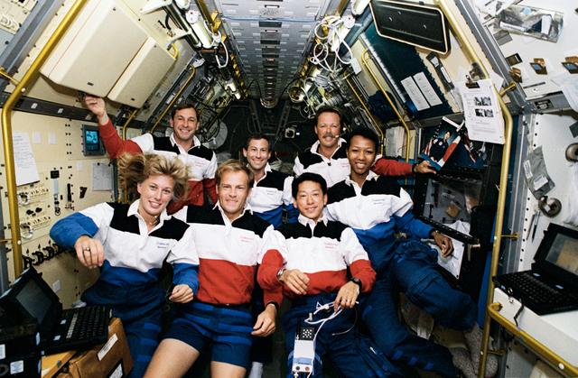 STS-47 crew poses for official onboard (in space) portrait in SLJ module