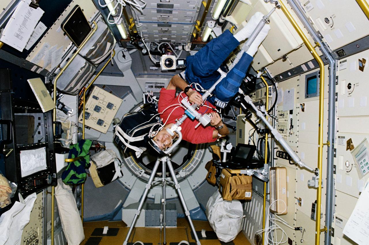 STS047-204-006 (12 - 20 Sept 1992) --- Dr. Mamoru Mohri, payload specialist representing Japan's National Space Development Agency (NASDA), participates in an experiment designed to learn more about Space Adaptation Syndrome (SAS).  The experiment is titled, "Comparative Measurement of Visual Stability in Earth and Cosmic Space."  During the experiment, Dr. Mohri tracked a flickering light target while eye movements and neck muscle tension were measured.  This 45-degree angle position was one of four studied during the eight-day Spacelab-J mission.