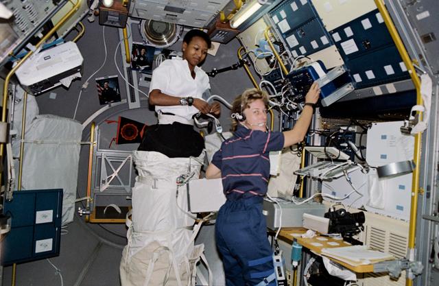 NASA image: STS-47 MS Davis and MS Jemison conduct LBNP experiment in the SLJ module