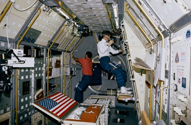 NASA image: Crewmember working on the spacelab Zeolite Crystal Growth experiment.