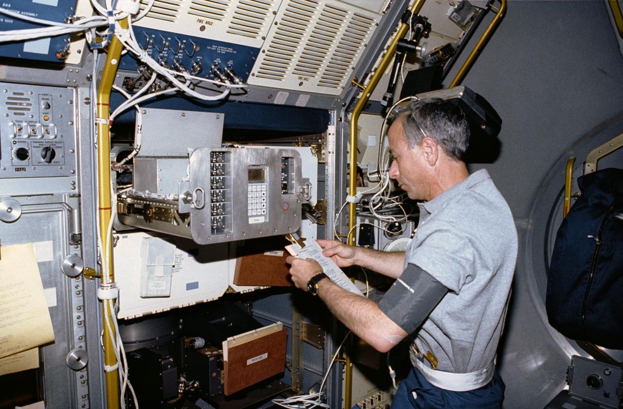 STS050-02-036 (25 June-9 July 1992) --- Astronaut Carl J. Meade, mission specialist, operates the Generic Bioprocessing Apparatus (GBA) in the Science Module aboard the Space Shuttle Columbia.  Meade was joined by four astronauts and two scientists from the private sector for the record-setting 14-day United States Microgravity Lab 1 (USML-1) mission.