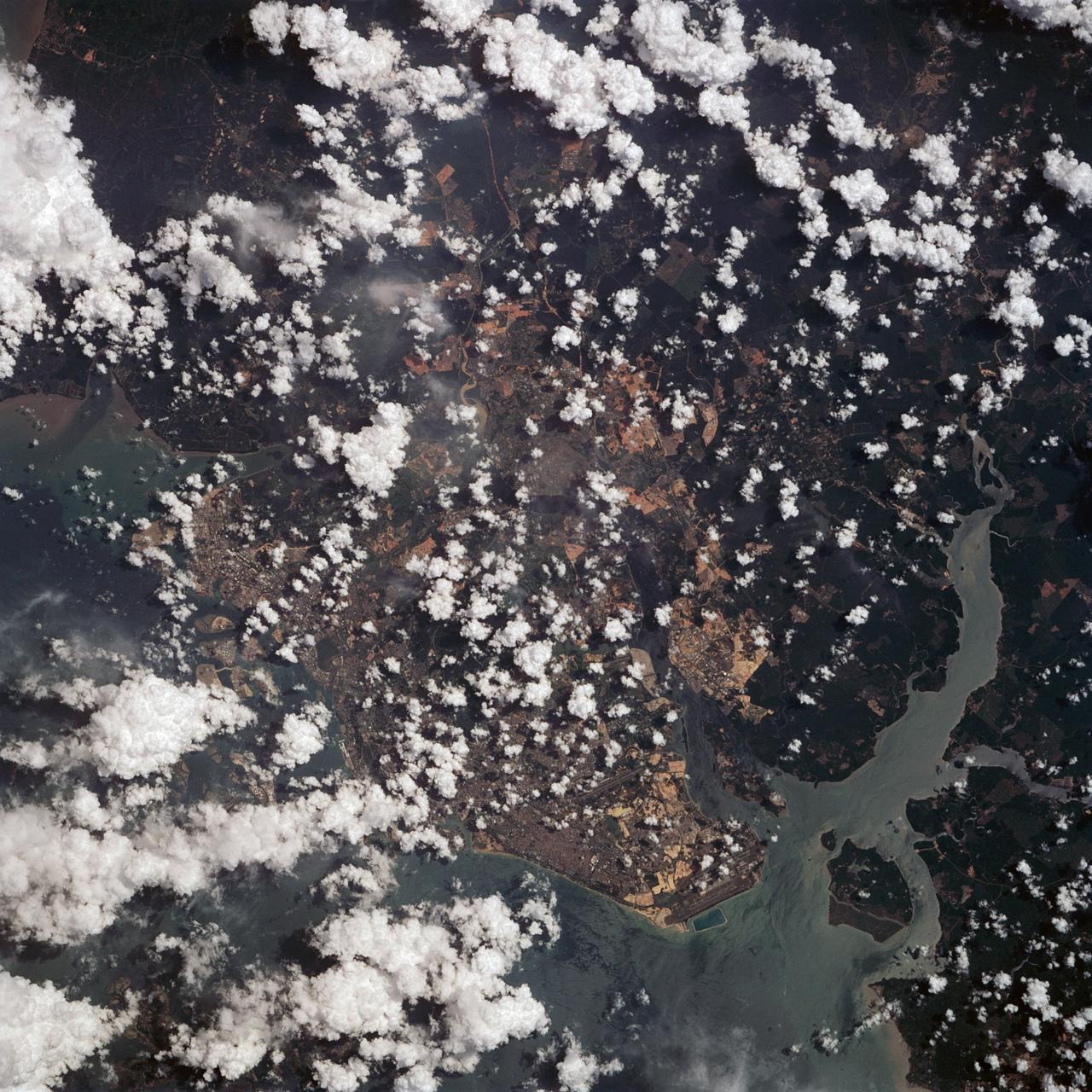 This view of the Malay Peninsula shows the city state of Singapore, Malaysia (1.5N, 104.0E) with all its urban, industrial and commercial land use areas. Singapore is located at the south tip of the Malay peninsula separated by the Johor Strait. The prosporous island state, once Asia's major trade center, is now highly industrialized despite its small size and its ideal location has made this island a hub of trade, shipping and service industries.
