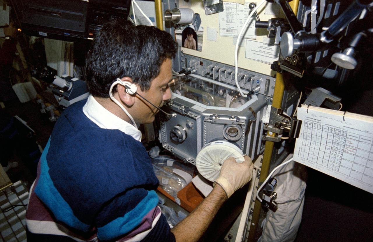 STS050-259-016 (25 June-9 July 1992) --- Payload specialist Lawrence J. DeLucas works at the  Multipurpose Glovebox (MPGB) in the science module aboard the Earth-orbiting Space Shuttle Columbia. Provided by the European Space Agency, the glovebox enables  crewmembers to handle, transfer and otherwise manipulate materials in ways that are impractical in the open science module.  At least 16 experiments were accommodated in the glovebox during this 14-day record-setting mission.