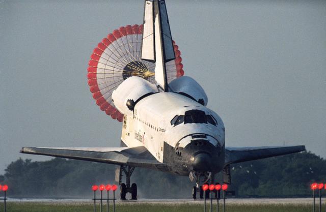 NASA image: STS-50 Columbia, OV-102, landing with drag chute deploy at KSC SLF runway 33