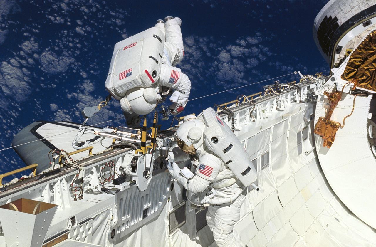 STS051-06-023 (16 Sept 1993) --- Astronauts James H. Newman (in bay) and Carl E. Walz, mission specialists, practice space walking techniques and evaluate tools to be used on the first Hubble Space Telescope (HST) servicing mission scheduled for later this year. Walz rehearses using the Power Ratchet Tool (PRT), one of several special pieces of gear to be put to duty during the scheduled five periods of extravehicular activity (EVA) on the STS-61 mission.