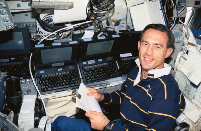 NASA image: Astronaut James Newman works with computers and GPS