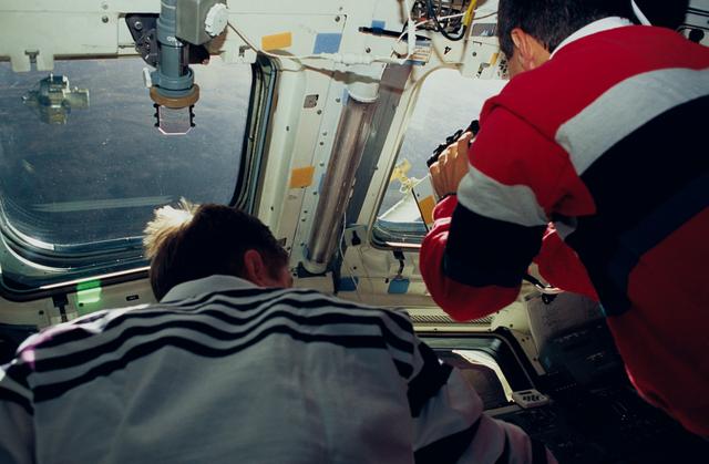 NASA image: Astronauts Culbertson and Bursch supporting ORFEUS and SPAS
