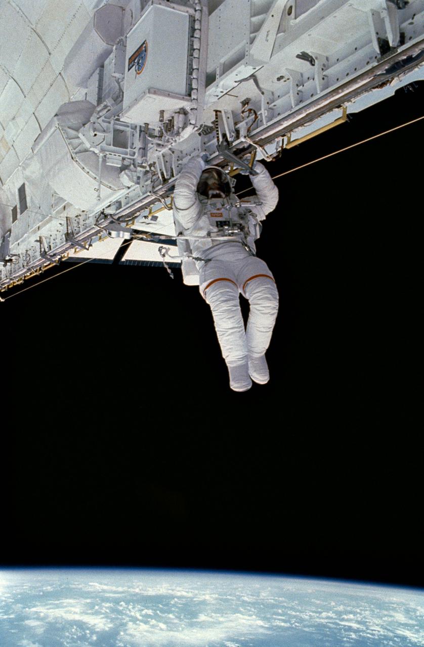 STS054-05-008 (17 Jan 1993) --- Astronaut Gregory J. Harbaugh translates along the starboard longeron of Endeavour's cargo bay. Astronauts Harbaugh and Mario Runco Jr., mission specialists, spent four-plus hours on the extravehicular activity (EVA) on January 17, 1993. Also onboard NASA's newest Shuttle for the six-day mission were astronauts John H. Casper, mission commander; and Donald R. McMonagle, pilot; and Susan J. Helms, mission specialist. The photograph was taken with a 35mm camera.