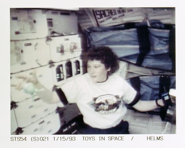 NASA image: STS-54 MS3 Helms uses DSO 802 & Physics of Toys frog toy on OV-105's middeck