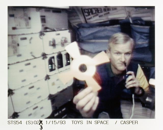 NASA image: STS-54 Commander Casper with DSO 802 & Physics of Toys on OV-105's middeck