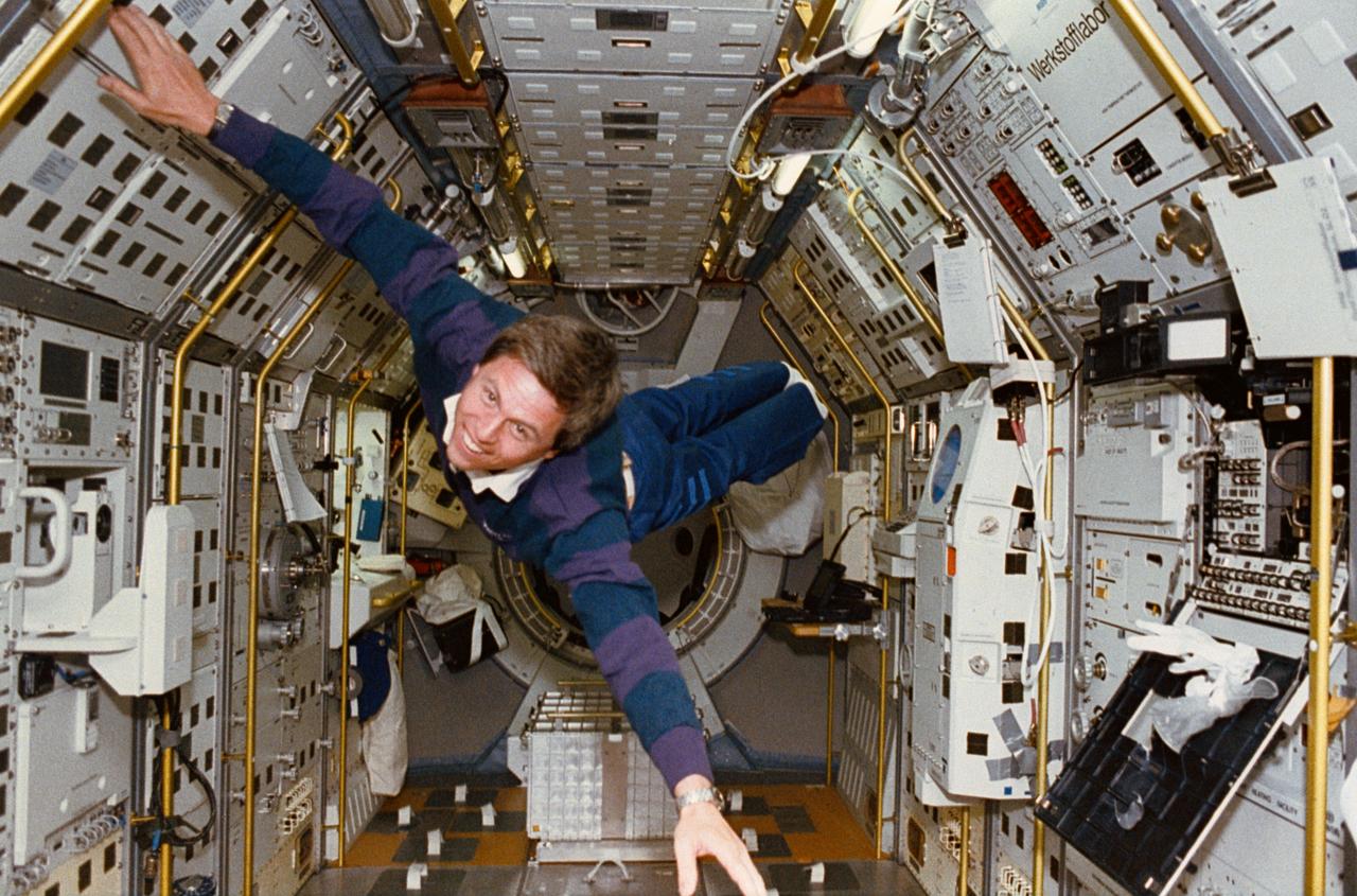 STS055-219-024 (26 April-6 May 1993) --- Ulrich Walter, STS-55 payload specialist representing the German Aerospace Research Establishment (DLR), demonstrates the microgravity aboard the Spacelab D-2 science module in Columbia's cargo bay.  The module served as his space laboratory and that of his six crewmates for l0 days.
