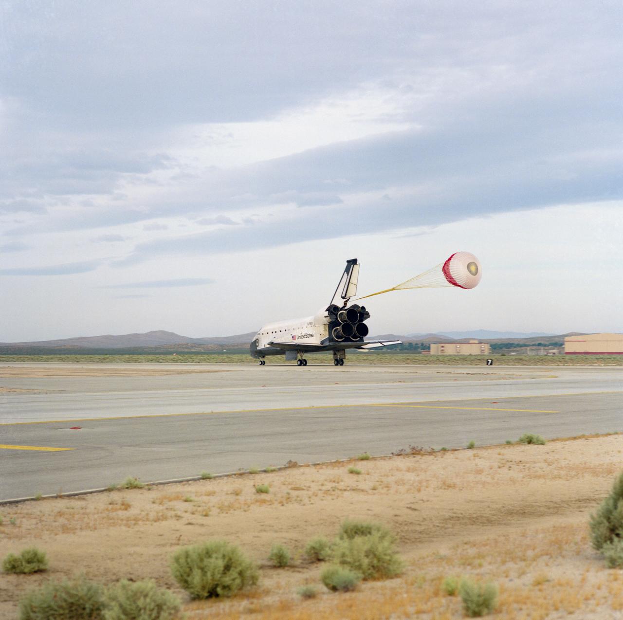 STS055-S-089 (6 May 1993) --- The main drag chute on the Space Shuttle Columbia is almost fully deployed in this three-quarter aft view of the vehicle's runway landing at Edwards Air Force Base in California.  Landing occurred at 7:30 a.m. (PDT), May 6, 1993.  Onboard the spacecraft were astronauts Steven R. Nagel, Terence T. (Tom) Henricks, Jerry L. Ross, Bernard Harris Jr. and Charles J. Precourt, along with German payload specialists Hans Schlegel and Ulrich Walter.