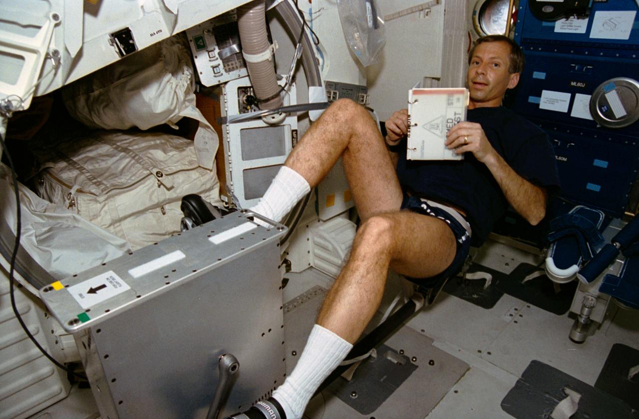 STS056-13-004 (8-17 April 1993) --- Astronaut Kenneth D. Cockrell pedals the bicycle ergometer on Discovery's middeck.  The mission specialist, along with four other NASA astronauts, spent nine days in space in support of the ATLAS 2 mission.