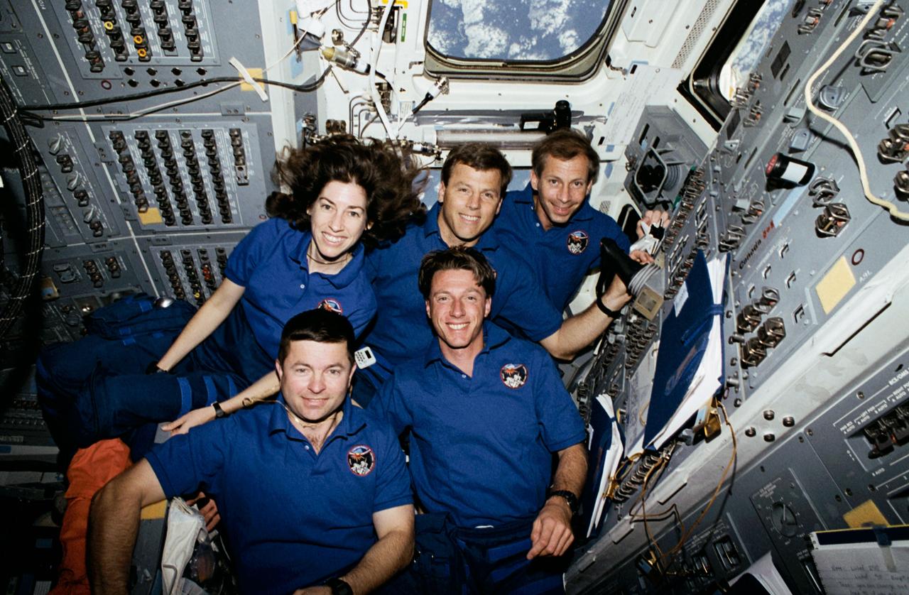 STS056-31-020 (8-17 April 1993) --- The five astronaut crew members assemble on the Space Shuttle Discovery's aft flight deck for the traditional inflight crew portrait.  In front are astronauts Kenneth D. Cameron, mission commander; and C. Michael Foale, mission specialist.  In back are (left to right) astronauts Ellen Ochoa, mission specialist; Stephen S. Oswald, pilot; and Kenneth D. Cockrell, mission specialist.  The five went on to spend nine days in Earth-orbit in support of the Atlas-2 mission.  A 35mm camera with a 20mm lens was used to expose this frame.