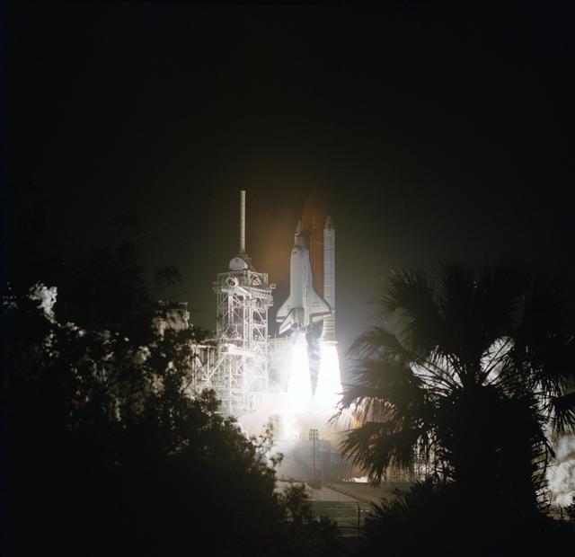 NASA image: STS-56 Discovery, OV-103, lifts off from KSC LC Pad 39B into darkness