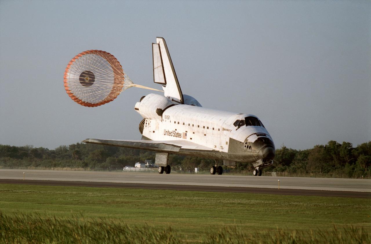 STS056-S-098 (17 April 1993) --- The drag chute is deployed following landing of the Space Shuttle Discovery on the Shuttle landing facility at the Kennedy Space Center to complete the STS-56\Atlas 2 mission. Touchdown occurred at 7:37 a.m. (EDT). Onboard the spacecraft were astronauts Kenneth D. Cameron, commander; Stephen S. Oswald, pilot; and C. Michael Foale, Ellen Ochoa and Kenneth D. Cockrell, mission specialists.