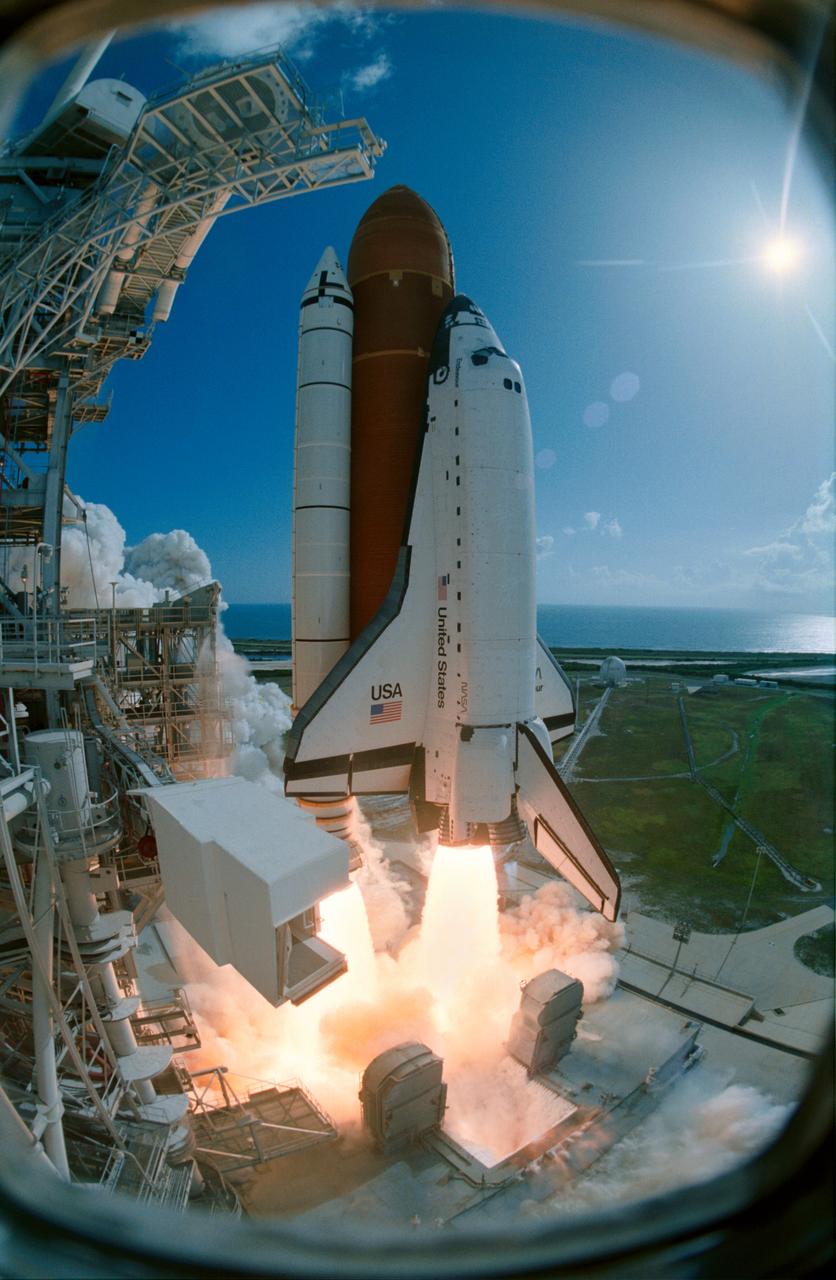 STS057-S-053 (21 June 1993) --- The Space Shuttle Endeavour lifts off Launch Pad 39B as captured on film by an audio-activated camera positioned at the 270-feet level on the Rotating Service Structure (RSS) at Launch Pad 39B.  STS-57 launch occurred at 9:07:22 a.m. (EDT), June 21, 1993.  The mission represents the first flight of the commercially developed SpaceHab laboratory module and also will feature a retrieval of the European Retrievable Carrier (EURECA).  Onboard for Endeavour's fourth flight are a crew of six NASA astronauts; Ronald J. Grabe, mission commander; Brian Duffy, pilot; G. David Low, payload commander; and Nancy J. Sherlock, Peter J. K. (Jeff) Wisoff and Janice E. Voss, all mission specialists.  An earlier launch attempt was scrubbed due to unacceptable weather conditions both at the Kennedy Space Center (KSC) and the overseas contingency landing sites.