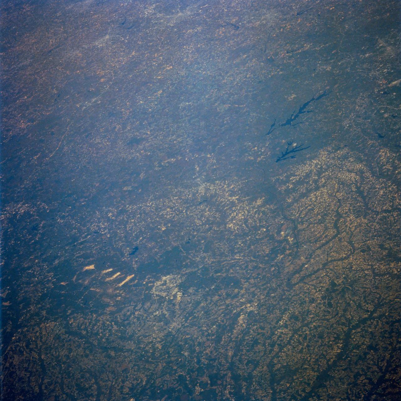 STS058-100-073 (18 Oct-1 Nov 1993) --- An unusually clear, northwestward view of central North Carolina shows the farms and timber of the inner coastal plain.  The city of Fayetteville, and Fort Bragg to the west, is prominent at lower left center.  The Research Triangle of Raleigh, Durham and Chapel Hill can be seen at upper right, upstream from Jordan Lake and Harris Lake on the New Hope River.