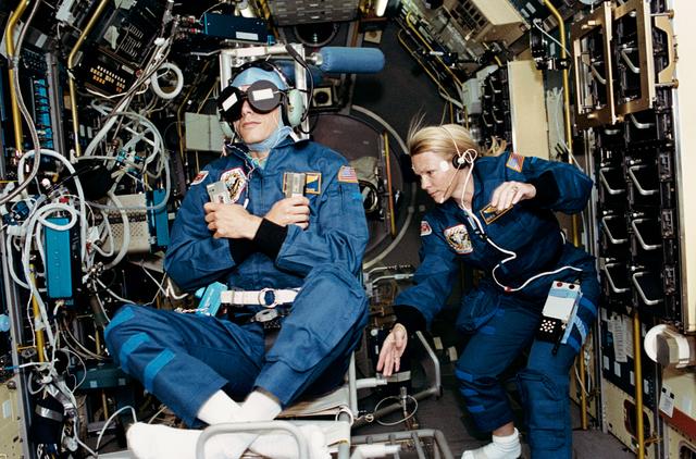 NASA image: Crewmember in SPACELAB wearing the Acceleration Recording Unit and Collar.