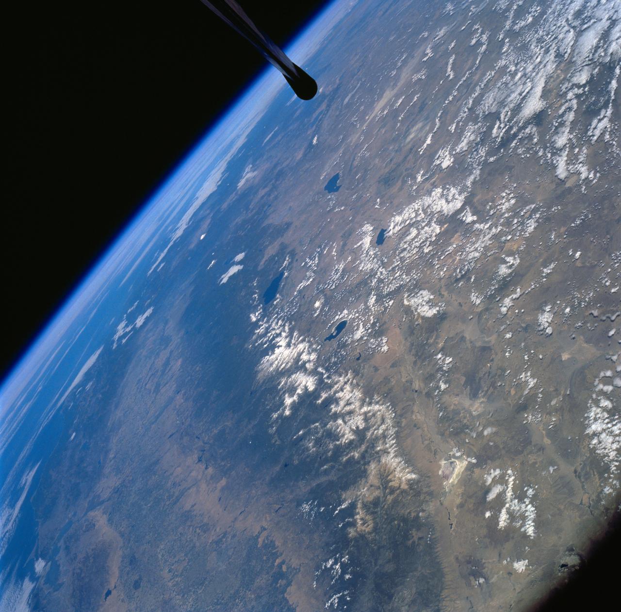 STS058-72-004 (18 Oct-1 Nov 1993) --- The Sierra Nevada Mountain Range can be seen in this north-looking high oblique view taken in October, 1993, by the STS-58 crew.  Visible in the view to the west of the Sierra Nevada are the San Joaquin and Sacramento Valleys of central California.  The San Francisco/Oakland Bay Area can be seen to the west of the valley at the extreme left of the photograph.  To the east or right of the Sierra Nevada, the basin and Range Region of central and northern Nevada is visible.  Mono Lake, Lake Tahoe and Pyramid Lake are also visible in this scene.  The long northwest/southeast trending Walker Lane Shear Zone, which lies just to the east (right) of the Sierra Nevada is also visible.  Near the top of the view (near the horizon), the snow covered volcanic peak Mount Shasta can be seen.  Over 645 kilometers (400 miles) long and from 65 to 130 kilometers (40 to 80 miles) wide, the Sierra Nevada have many peaks in excess of 3,300 meters (11,000 feet) above sea level.  A titled fault block in structure (the largest in the United States) and shaped by glaciers during the last ice age over 12,000 years ago, the Sierra Nevada eastern front rises sharply from the Great Basin of Nevada, while its western slope descends gradually to the hills bordering the Central Valley of California.  Snow-fed streams supply much of the irrigation water to the Central Valley and to western Nevada and also generate hydroelectricity.  Recent above normal precipitation (snowfall) of the last two years has helped in alleviating the drought conditions that had prevailed throughout most of California in the mid and late 1980's and early 1990's.