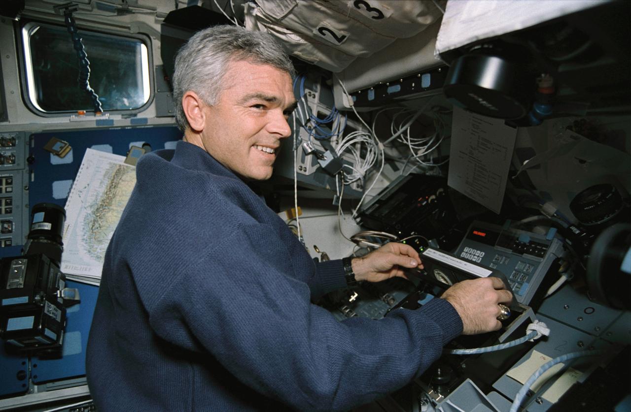 STS059-09-012 (9-20 April 1994) --- On the Space Shuttle Endeavour's aft flight deck, astronaut Michael R. (Rich) Clifford, mission specialist, inserts a tape in the payload high rate recorder.  Three of these state-of-the-art recorders captured four times the amount of data that could be radioed to the ground.  The 183 tapes, each containing 40 megabytes of data, will be turned into images over the next year, and analyzed over the next decade.  Clifford was joined in space by five other NASA astronauts for a week and a half of support to the Space Radar Laboratory (SRL-1)/STS-59 mission.