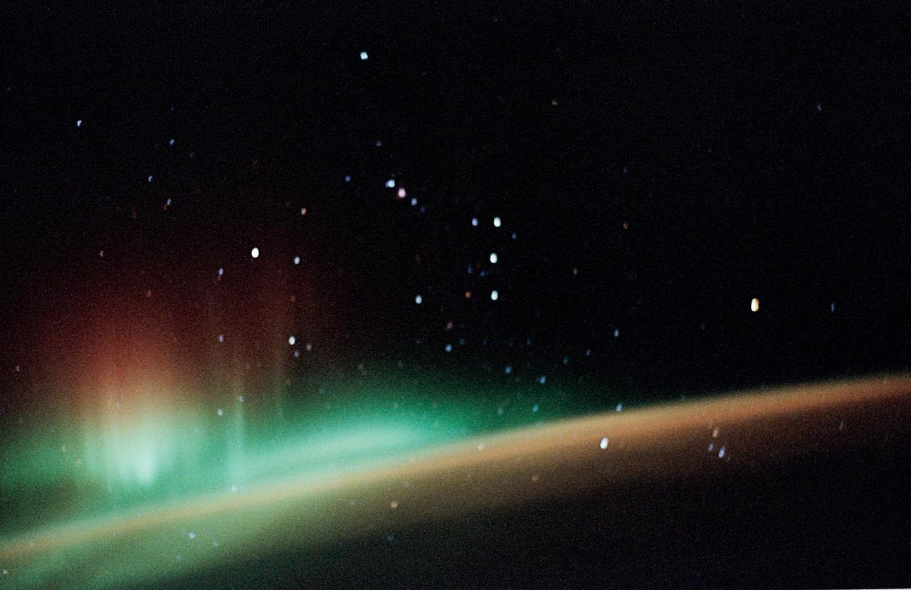 STS059-52-029 (9-20 April 1994) --- The constellation Orion is backdropped against a colorful display of the Southern Lights (aurora australis) in this 35mm image.  Six NASA astronauts went on to spend a week and a half aboard the Space Shuttle Endeavour in support of the Space Radar Laboratory (SRL-1) mission.