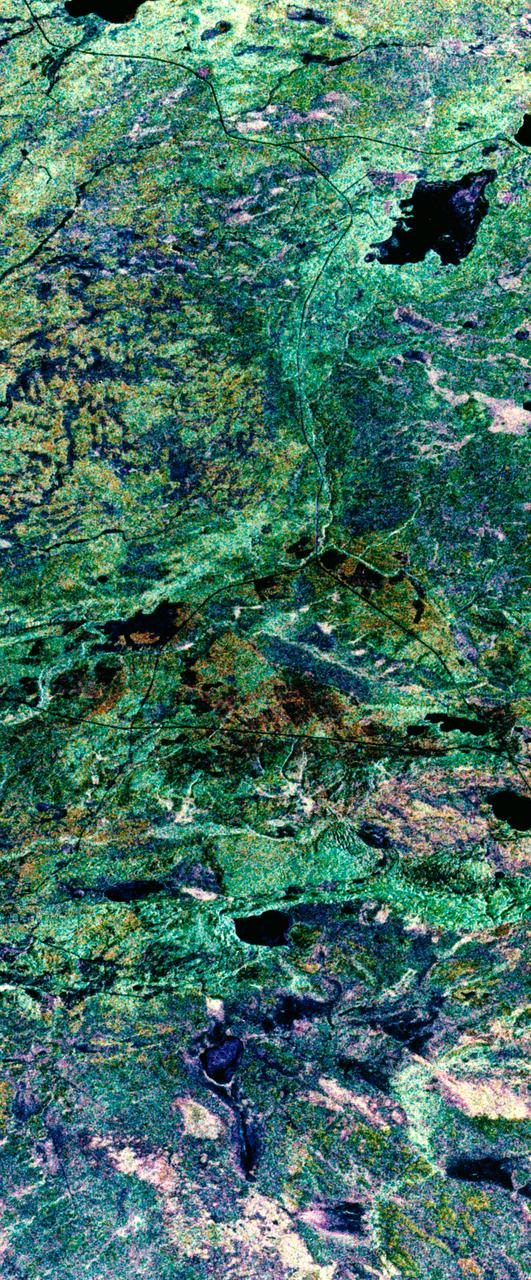 STS059-S-039 (11 April 1994) --- This is a false-color composite of Prince Albert, Canada, centered at 53.91 north latitude and 104.69 west longitude.  This image was acquired by the Spaceborne Imaging Radar-C and X-Band Synthetic Aperture Radar (SIR-C/X-SAR) aboard the Space Shuttle Endeavour on its 20th orbit.  The area is located 40 kilometers (25 miles) north and 30 kilometers (20 miles) east of the town of Prince Albert in the Saskatchewan province of Canada.  The image covers the area east of the Candle Lake, between gravel surface Highways 120 and 106 and west of 106.  The area in the middle of the image covers the entire Nipawin (Narrow Hills) provincial park.  The look angle of the radar is 30 degrees and the size of the image is approximately 20 kilometers by 50 kilometers (12 by 30 miles).  The image was produced by using only the L-Band.  The three polarization channels HH, HV and VV are illustrated by red, green and blue respectively.  The changes in the intensity of each color are related to various surface conditions such as variations in forest stands, frozen or thawed condition of the surface, disturbances (fire and deforestation), and areas of re-growth.  Most of the dark areas in the image are the ice-covered lakes in the region.  The dark area on the top right corner of the image is the White Gull Lake north of the intersection of Highway 120 and 913.  The right middle part of the image shows Lake Ispuchaw and Lower Fishing Lake.  The deforested areas are also shown by dark areas in the image.  Since most of the logging practice at the Prince Albert area is around the major highways, the deforested areas can be easily detected as small geometrically shaped dark regions along the roads.  At the time of the SIR-C/X-SAR overpass, a major part of the forest is either frozen or undergoing the spring thaw.  The L-Band HH shows a high return in the jack pine forest.  The reddish areas in the image are old jack pine forest, 12-17 meters (40-55 feet) in height and 60-75 years old.  The orange-greenish areas are young jack pine trees, 3-5 meters (10-16 feet) in height and 11-16 years old.  The green areas are due to the relative high intensity of the HV channel which is strongly correlated with the amount of biomass.  L-Band HV channel shows the biomass variations over the entire region.  Most of the green areas, when compared to the forest cover maps are identified as black spruce trees.  The dark blue and dark purple colors show recently harvested or re-growth areas respectively.  SIR-C/X-SAR is part of NASA's Mission to Planet Earth (MTPE).  SIR-C/X-SAR radars illuminate Earth with microwaves allowing detailed observations at any time, regardless of weather or sunlight conditions.  SIR-C/X-SAR uses three microwave wavelengths: L-Band (24 cm), C-Band (6 cm), and X-Band (3 cm).  The multi-frequency data will be used by the international scientific community to better understand the global environment and how it is changing.  The SIR-C/X-SAR data, complemented by aircraft and ground studies, will give scientists clearer insights into those environmental changes which are caused by nature and those changes which are induced by human activity.  SIR-C was developed by NASA's Jet Propulsion Laboratory (JPL).  X-SAR was developed by the Dornire and Alenia Spazio Companies for the German Space Agency, Deutsche Agentur fuer Raumfahrtangelegenheiten (DARA), and the Italian Space Agency, Agenzia Spaziale Italiana (ASI).    JPL Photo ID: P-43886