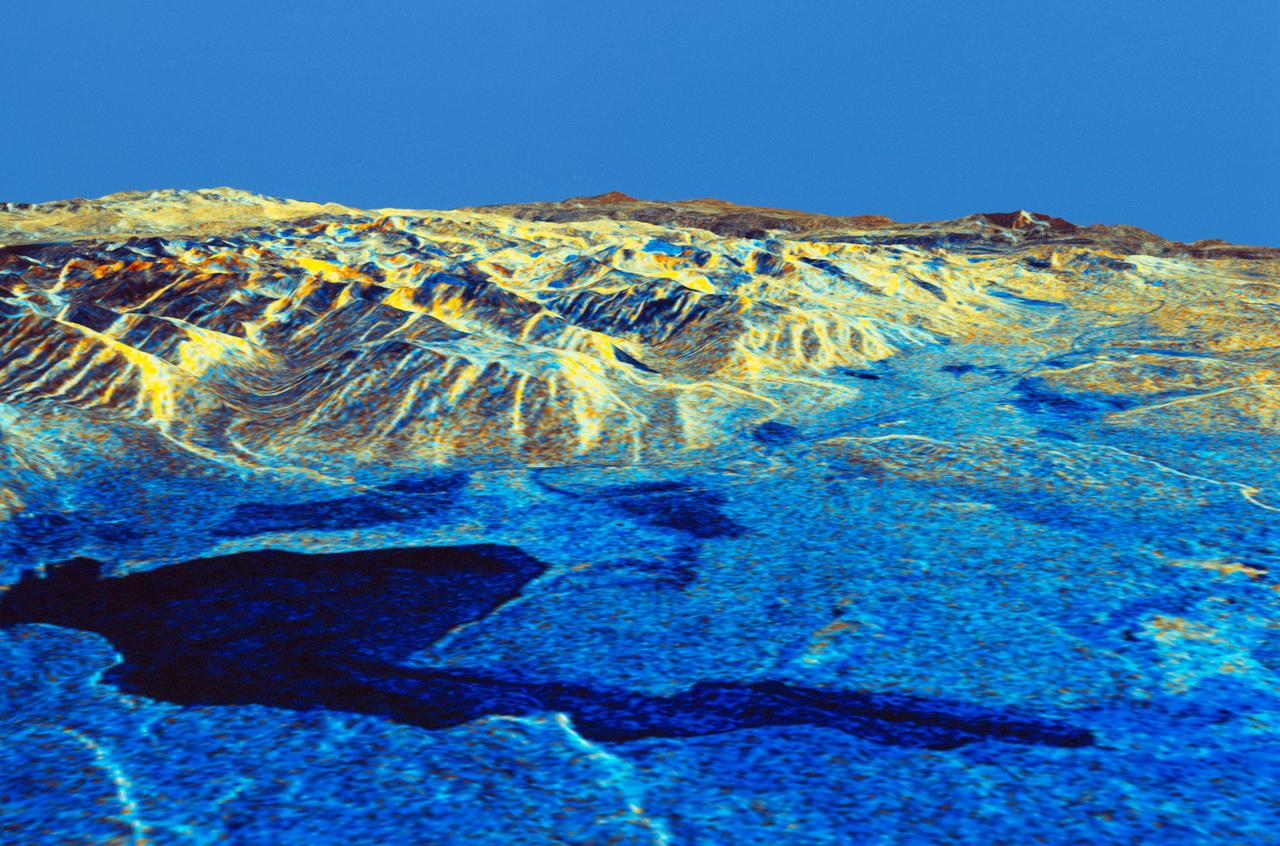 STS059-S-084 (17 April 1994) --- This is a three-dimensional perspective of Mammoth Mountain, California.  This view was constructed by overlaying a SIR-C radar image on a U.S. Geological Survey digital elevation map.  Vertical exaggeration is 2x.  The image is centered at 37.6 degrees north, 119.0 degrees west.  It was acquired from the Spaceborne Imaging Radar-C and X-Band Synthetic Aperture Radar (SIR-C/X-SAR) onboard the Space Shuttle Endeavour on its 67th orbit, April 13, 1994.  In this color representation, red is C-Band HV-polarization, green is C-Band VV-polarization and blue is the ratio of C-Band VV to C-Band HV.  Blue areas are smooth and yellow areas are rock outcrops with varying amounts of snow and vegetation.  Crowley Lake is in the foreground and Highway 395 crosses in the middle of the image.  Mammoth Mountain is shown in the upper right.  SIR-C/X-SAR is part of NASA's Mission to Planet Earth (MTPE).  SIR-C/X-SAR radars illuminate Earth with microwaves allowing detailed observations at any time, regardless of weather or sunlight conditions.  SIR-C/X-SAR uses three microwave wavelengths: L-Band (24 cm), C-Band (6 cm), and X-Band (3 cm).  The multi-frequency data will be used by the international scientific community to better understand the global environment and how it is changing.  The SIR-C/X-SAR data, complemented by aircraft and ground studies, will give scientists clearer insights into those environmental changes which are caused by nature and those changes which are induced by human activity.  SIR-C was developed by NASA's Jet Propulsion Laboratory (JPL).  X-SAR was developed by the Dornire and Alenia Spazio Companies for the German Space Agency, Deutsche Agentur fuer Raumfahrtangelegenheiten (DARA), and the Italian Space Agency, Agenzia Spaziale Italiana (ASI).    JPL Photo ID: P-43933