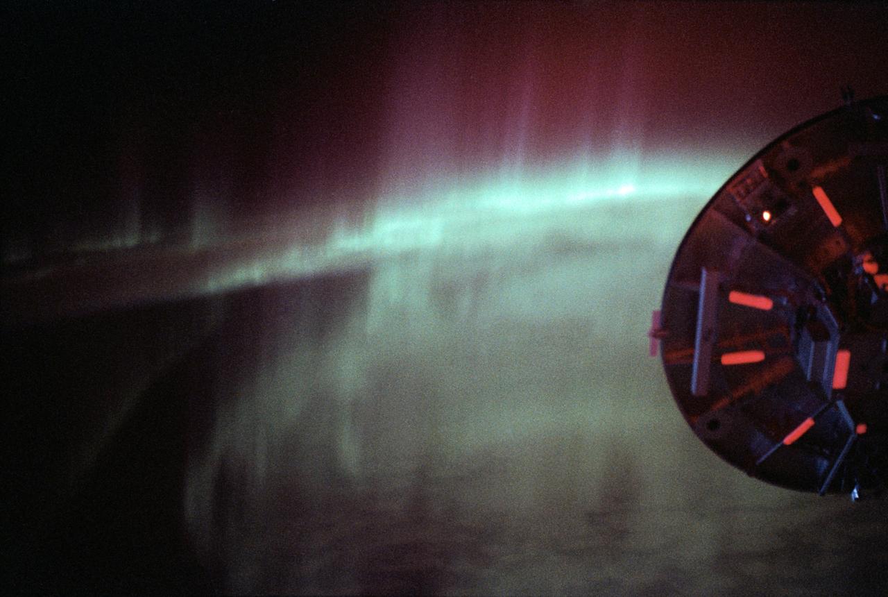 STS060-09-024 (3-11 Feb 1994) --- As the Space Shuttle Discovery flew over a point between New Zealand and Australia, one of the STS-60 crew members used a 35mm camera to capture this image featuring three-fourths of the disc of the Wake Shield Facility (WSF) back dropped against the Southern Lights.  The WSF was in the grasp of the Remote Manipulator System (RMS) end effector (out of frame at right).
