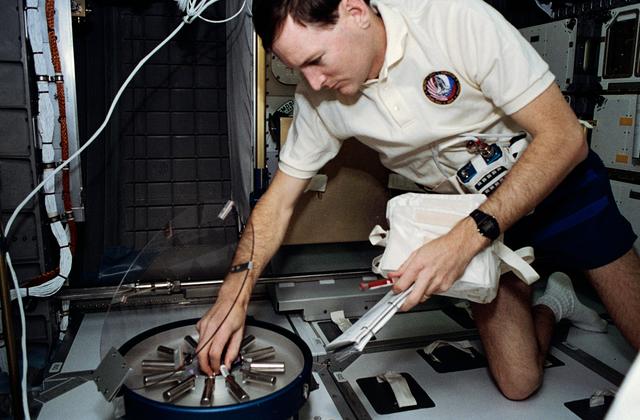 NASA image: Astronaut Kenneth Reightler processes biomedical samples in SPACEHAB