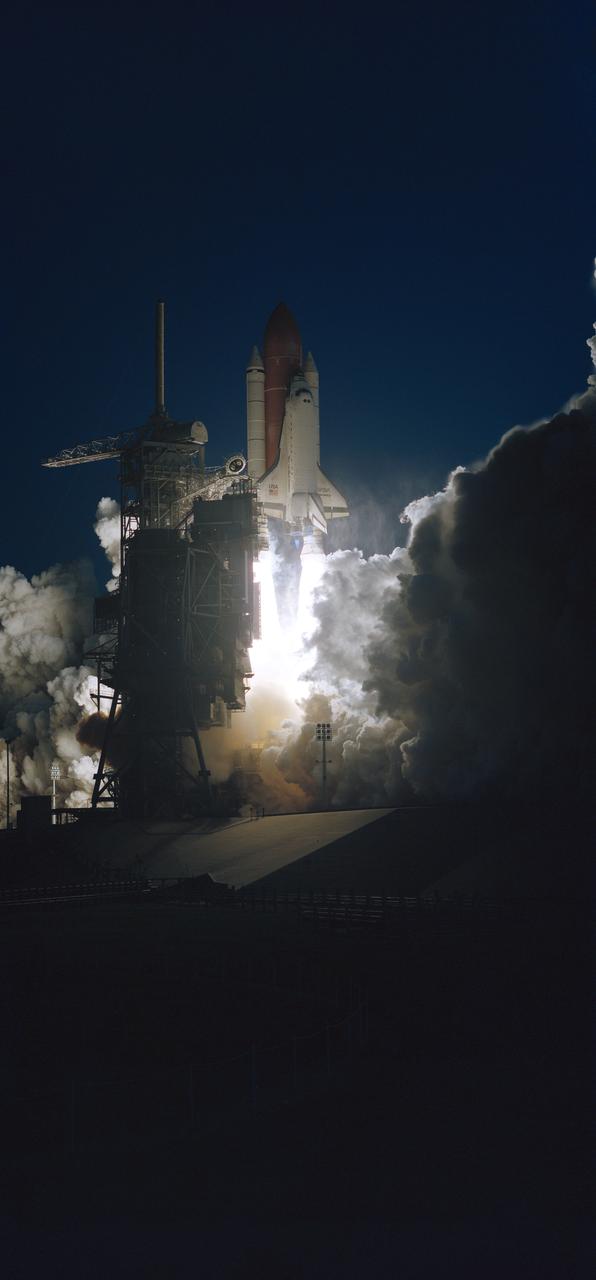 Launch Complex 39 is in partial darkness as the Space Shuttle Discovery heads toward an eight-day mission in Earth orbit. Liftoff occurred as scheduled at 7:10 a.m., February 3, 1994.