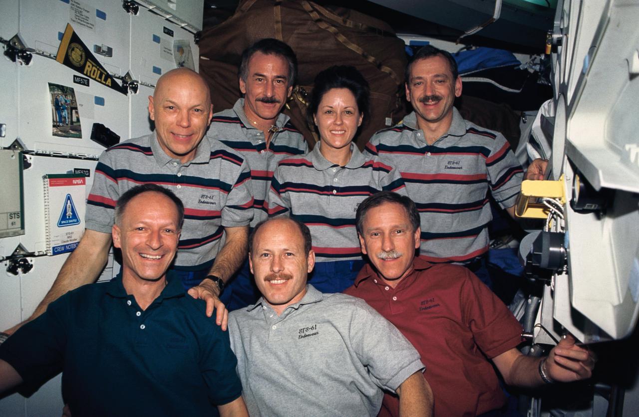 STS061-11-004 (2-13 Dec 1993) --- Traditional inflight portrait for the crew of the Hubble Space Telescope (HST) servicing mission.  On the front row are the three crew members who assisted from inside the Space Shuttle Endeavour's cabin throughout the five space walks.  They are, left to right, Swiss scientist Claude Nicollier, mission specialist, along with astronauts Kenneth D. Bowersox, pilot; and Richard O. Covey, mission commander.  Back row -- all space walkers on this flight -- are astronauts F. Story Musgrave, payload commander; Jeffrey A. Hoffman, Kathryn D.  Thornton and Thomas D. Akers, all mission specialists.