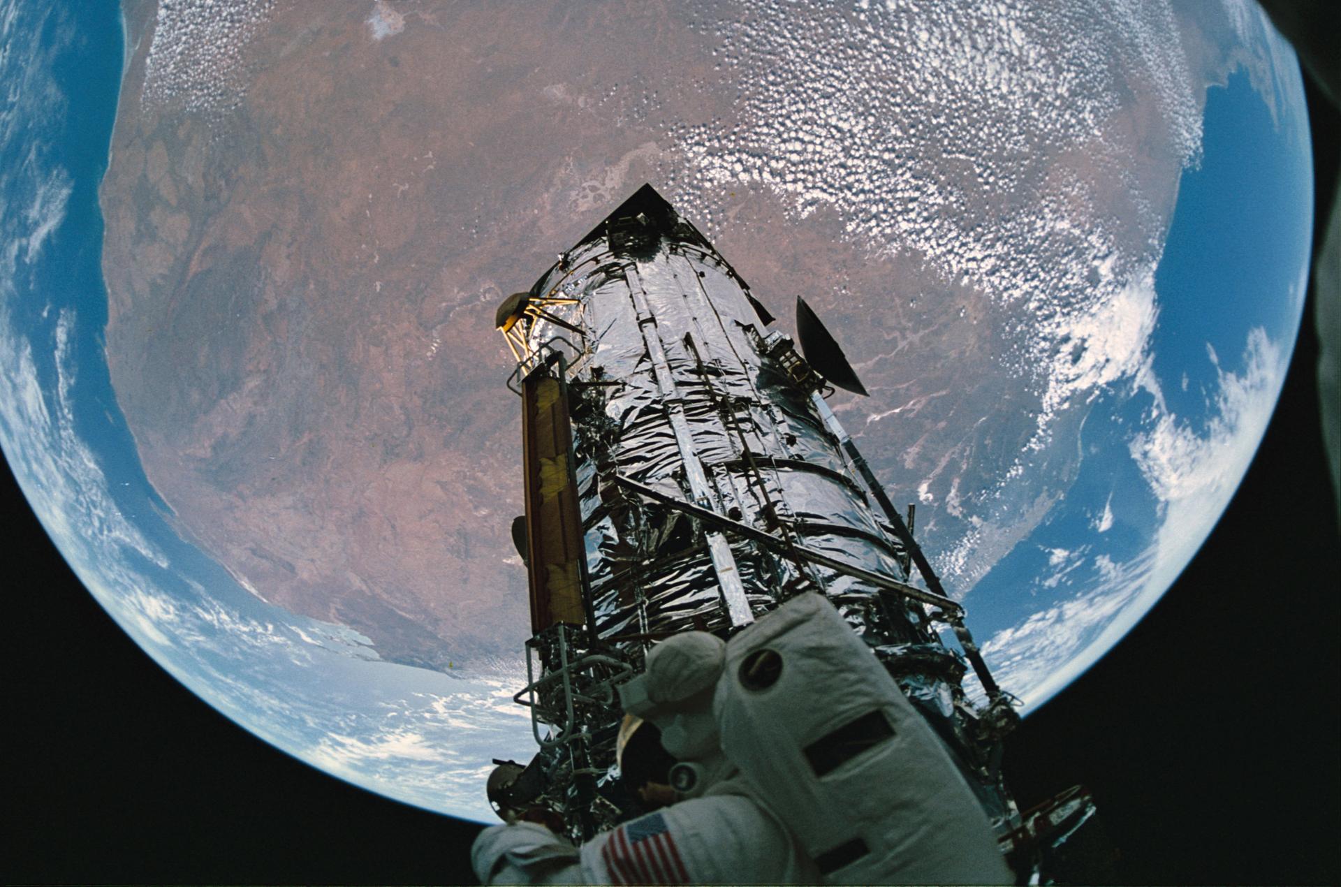 Fisheye view of HST and the Earth