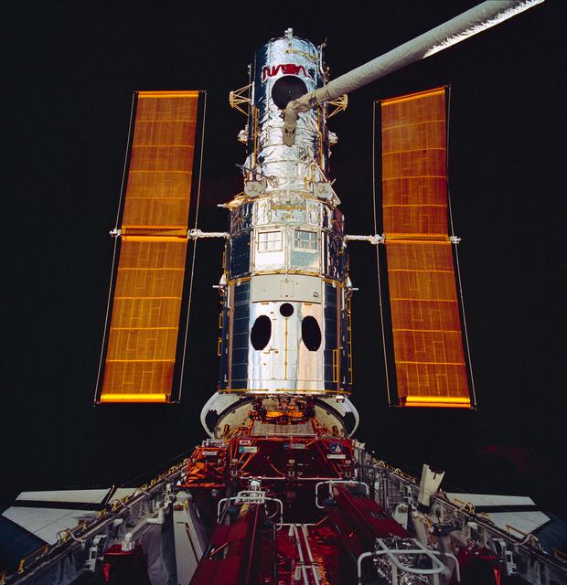 NASA image: Hubble Space Telescoe being surveyed by cameras mounted on the RMS