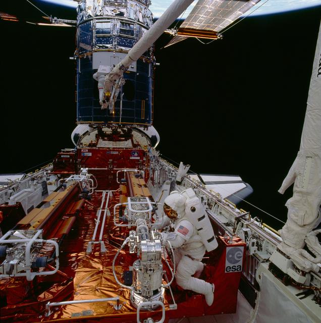 Astronauts Musgrave and Hoffman during first STS-61 EVA