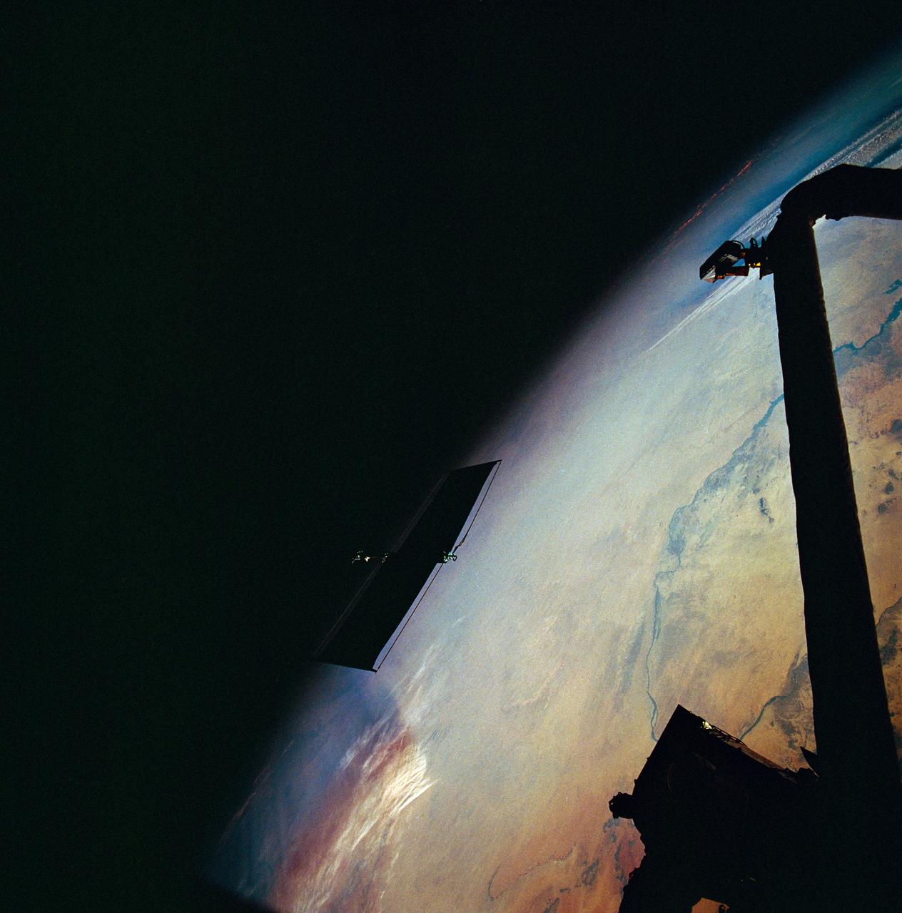 STS061-95-031 (6 Dec 1993) --- The damaged solar array panel removed from the Hubble Space Telescope (HST) is backdropped over northern Sudan.  Astronaut Kathryn C. Thornton, just out of frame at top right, watched the panel after releasing it moments earlier.
