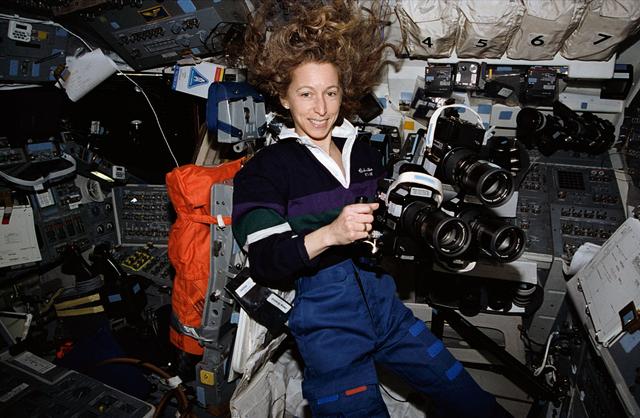 NASA image: Astronaut Marsha Ivins prepares to use three Hasselblad cameras together