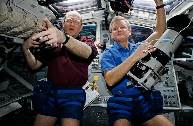 NASA image: Astronauts Casper and Gemar prepare to use cameras