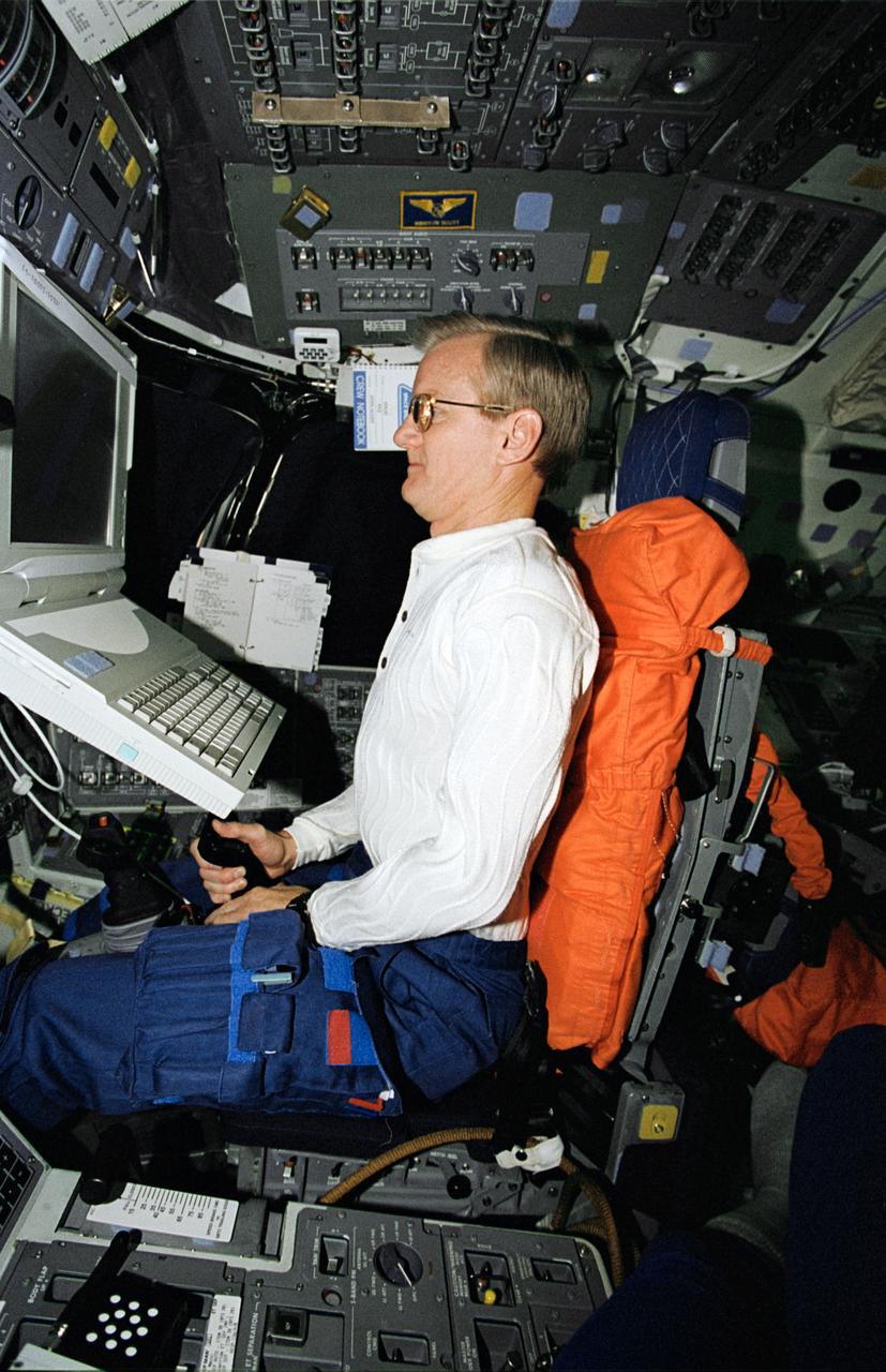 STS062-15-013 (4-18 March 1994) --- Astronaut John H. Casper, mission commander, participates in an experiment that measures the effects of space flight on pilot proficiency.  Astronauts Casper and Andrew M. Allen, pilot, continued the testing of the Portable Inflight Landing Operations Trainer (PILOT), which first flew onboard Columbia in October of 1993.