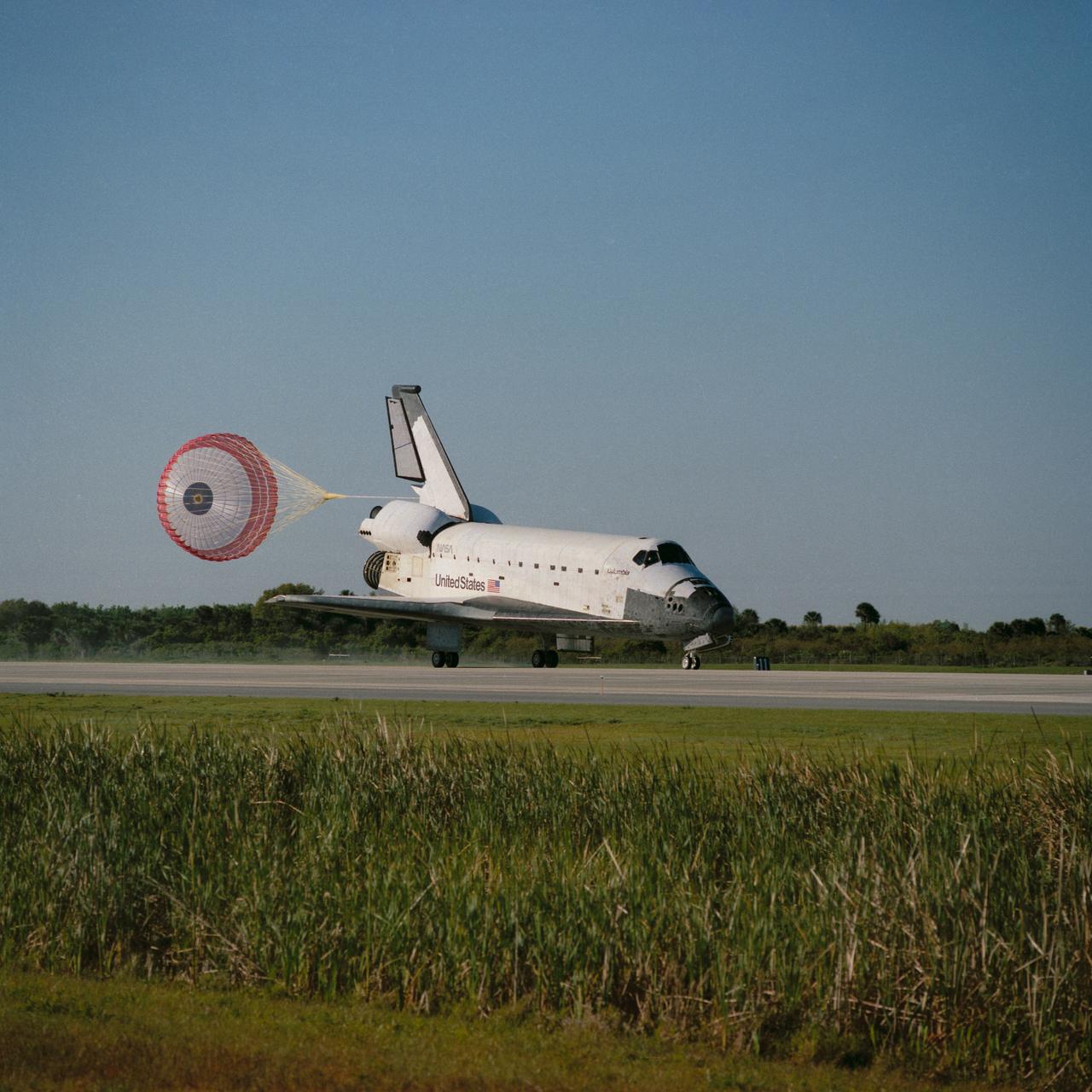 STS062-S-029 (18 March 1994) --- The drag chute on the Space Shuttle Columbia is deployed as the spacecraft rolls down the Shuttle landing facility at Kennedy Space Center (KSC).  The scene followed almost 14 days in earth orbit for five NASA astronauts and a variety of experiments.  Touchdown occurred at 8:09 a.m. (EST), March 18, 1994.  Thirteen days, 23 hours and 16 minutes were logged by the crew members -- astronauts John H. Casper, Andrew M. Allen, Marsha S. Ivins, Pierre J. Thuot and Charles D. (Sam) Gemar.