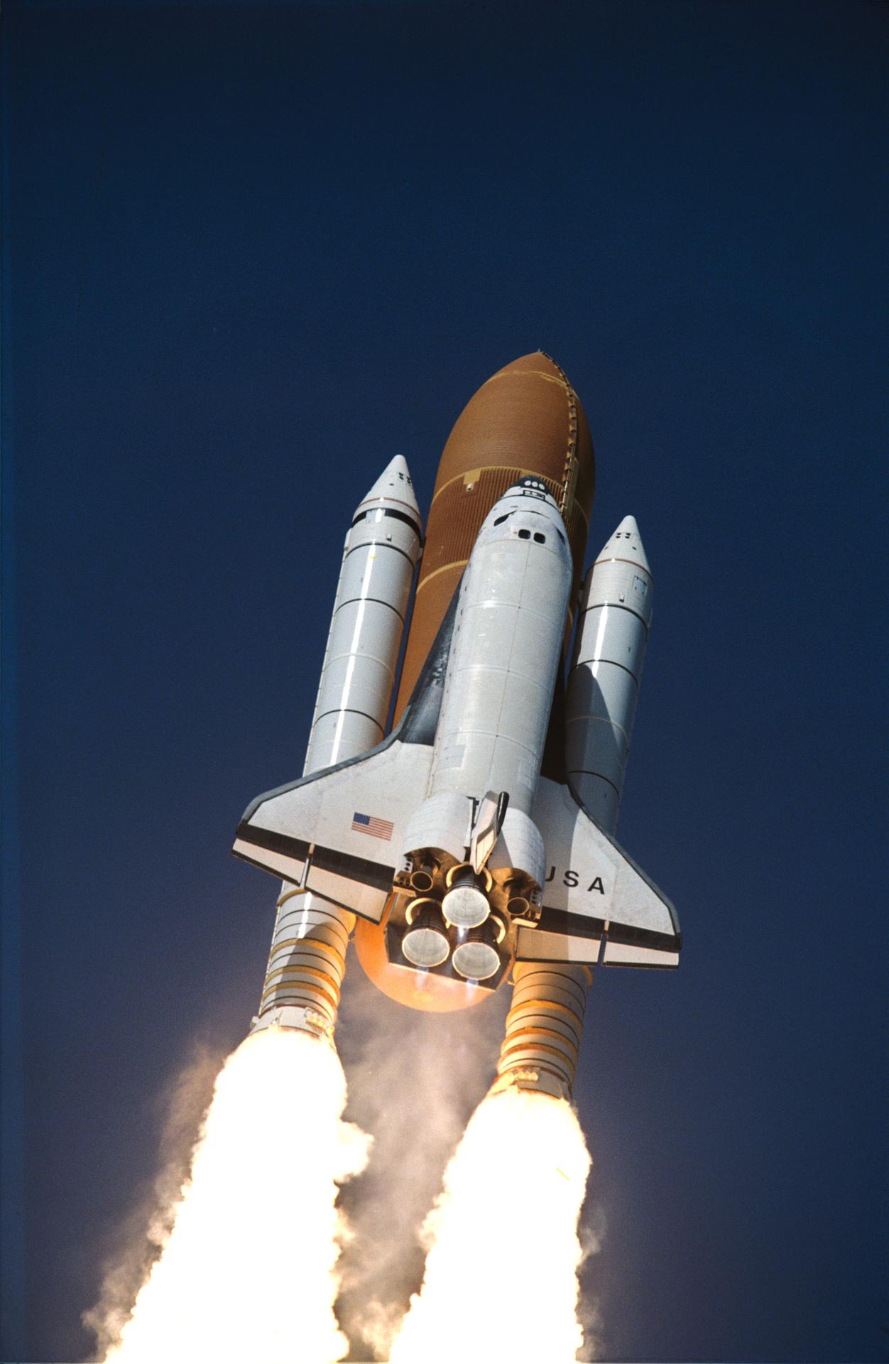 Columbia shuttle in blue sky after the STS-62 launching