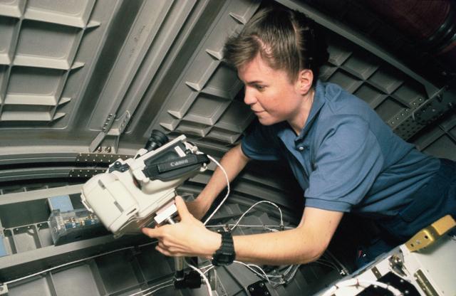 NASA image: Astronaut Janice Voss with video camera in Spacehab-3