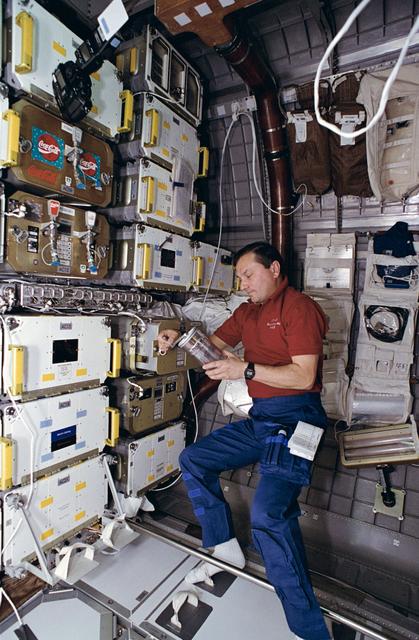NASA image: Russian cosmonaut Vladimir Titov works with samples for the CGBA