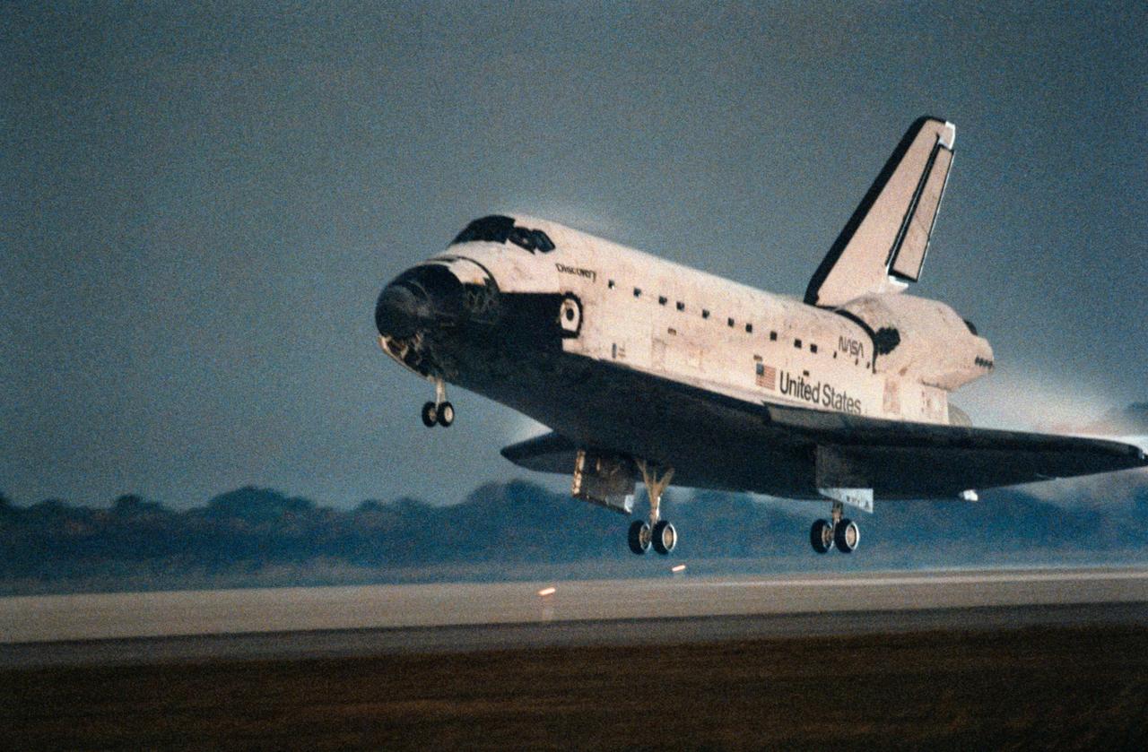STS063-S-012 (11 Feb 1995) --- The Space Shuttle Discovery is about to touch down on Runway 15 at the Kennedy Space Center's (KSC) Shuttle Landing Facility to complete an eight-day mission. Touchdown occurred at 6:50:19 a.m. (EST), February 11, 1995. Onboard the Space Shuttle Discovery were astronauts James D. Wetherbee, mission commander; Eileen M. Collins, pilot; Bernard A. Harris Jr., payload commander; mission specialists C. Michael Foale, Janice E. Voss, and cosmonaut Vladimir G. Titov.