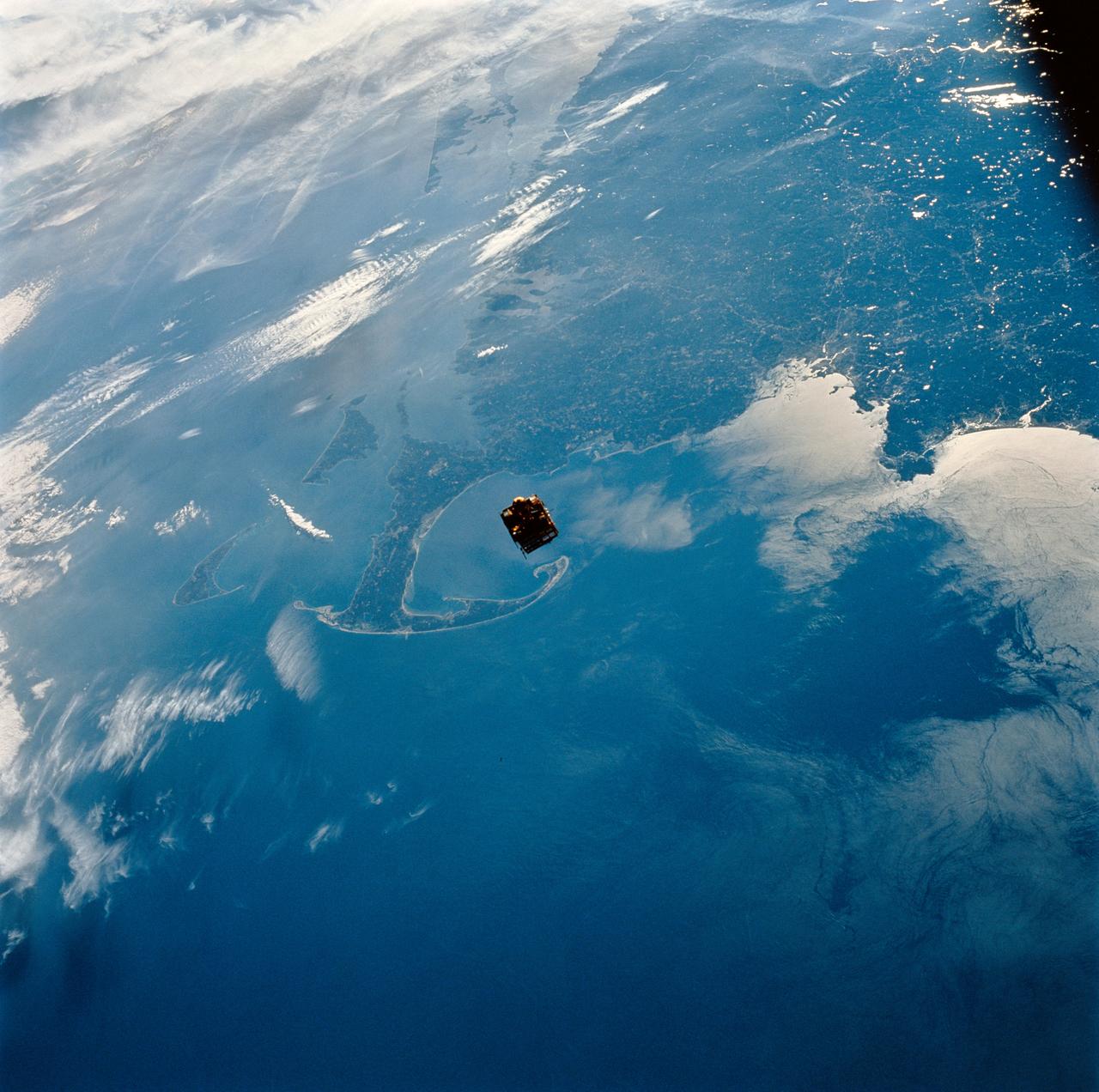 STS064-111-041 (12 Sept. 1994) ---- Backdropped against New England's coast, the Shuttle Pointed Autonomous Research Tool for Astronomy (SPARTAN-201) satellite begins its separation from the space shuttle Discovery.  The free-flying spacecraft, 130 nautical miles above Cape Cod at frame center, remained some 40 miles away from Discovery until the crew retrieved it two days later. Photo credit: NASA or National Aeronautics and Space Administration